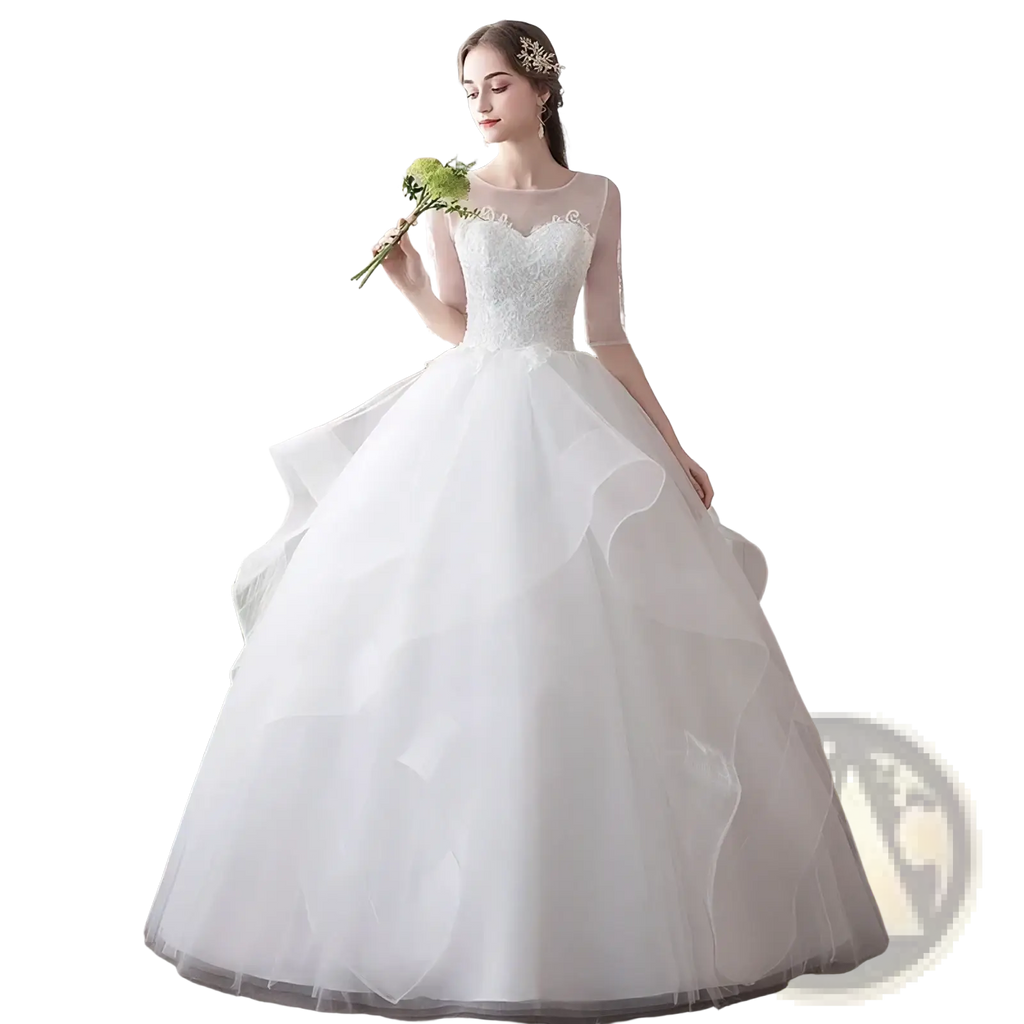 A white lace ball gown wedding dress with sheer long sleeves and a voluminous tulle skirt plus size