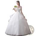 A white lace ball gown wedding dress with sheer long sleeves and a voluminous tulle skirt plus size