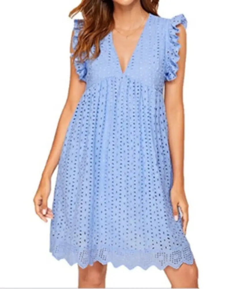 A light blue lace jacquard v neck eyelet beach dress with ruffled cap sleeves pockets and scalloped hem