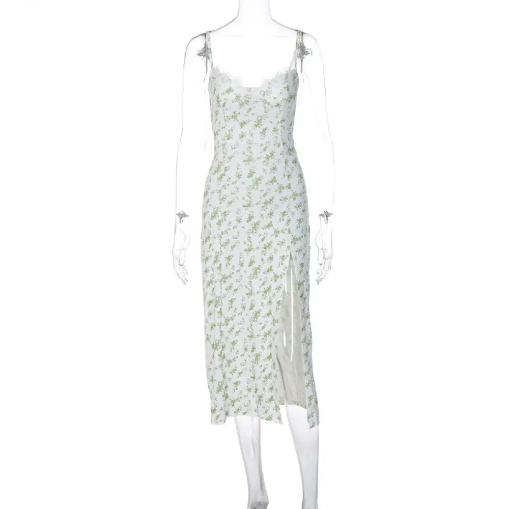A delicate mint green lace floral print satin midi dress with thin straps and a side slit