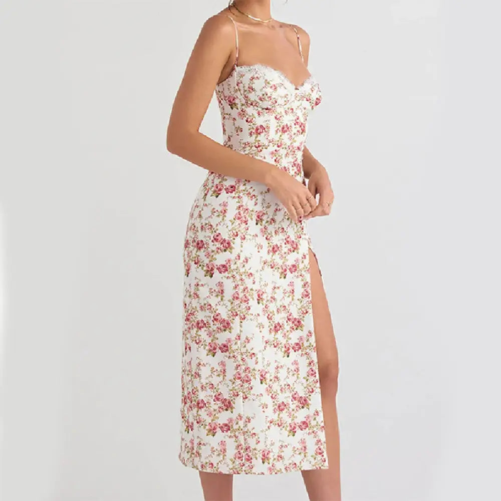 A white lace floral print satin midi dress with thin spaghetti straps and a side slit for elegant occasions