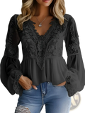 Black lace peplum blouse with sheer flowing long sleeves made of lace for casual wear