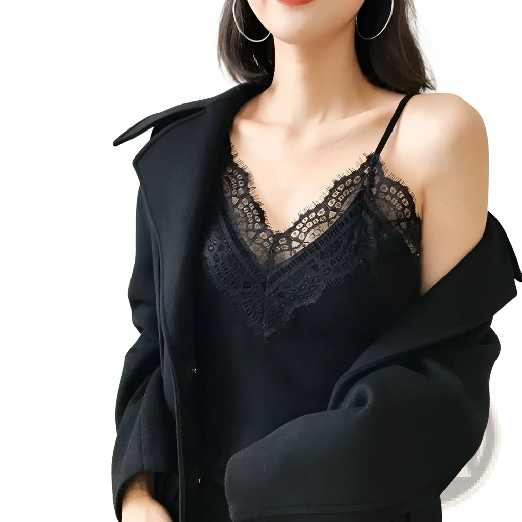 Black lace trim camisole top with delicate floral patterns and thin spaghetti straps in a soft lace material