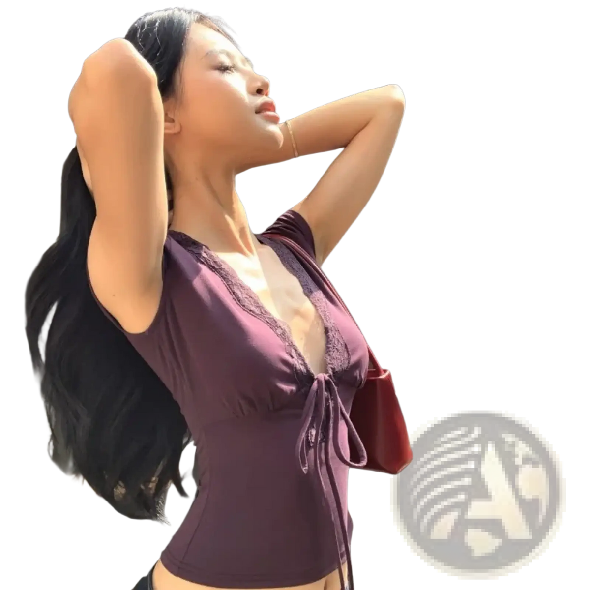 A deep purple lace trim v neck crop top with a tied waistband made of delicate lace fabric