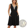 Black sleeveless v-neck a-line dress with intricate white lace trim along neckline and side pockets for elegant wear