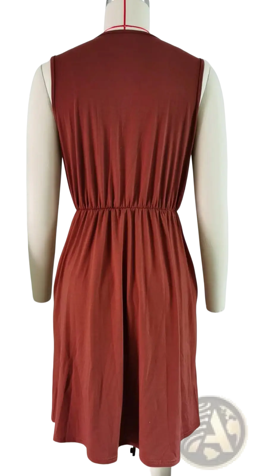 Sleeveless rust-colored a-line dress with lace trim v-neck, gathered waist, soft fabric, and pockets