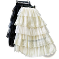 Cream-colored high waisted a line long skirt with tiered tulle, delicate lace trim, and floral embroidery