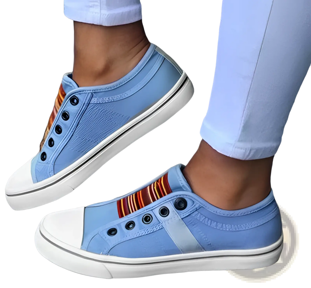 Laceless light blue canvas sneakers with white soles and a colorful striped accent for casual slip on wear