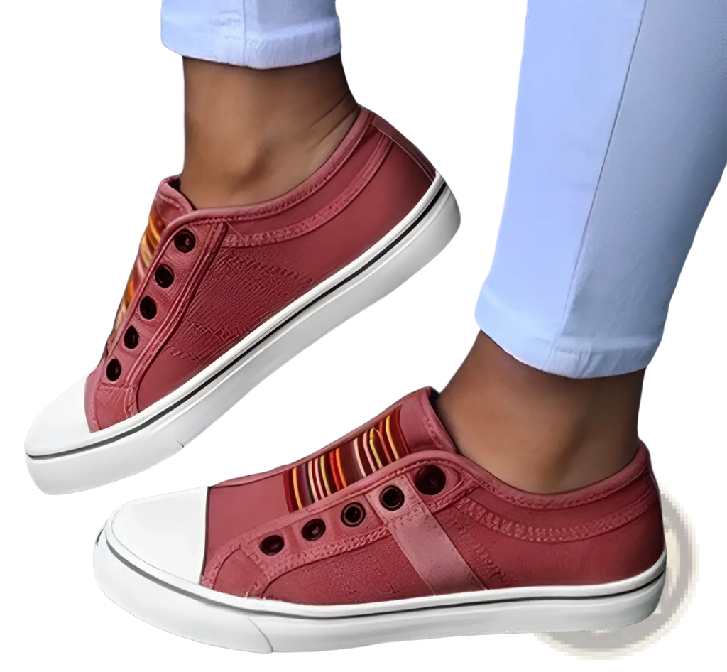 Pink laceless canvas sneakers slip on loafers with white rubber toe caps soles and colorful striped side accents