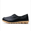 Black leather premium genuine slip on flat shoe with tan segmented rubber sole for comfortable wear