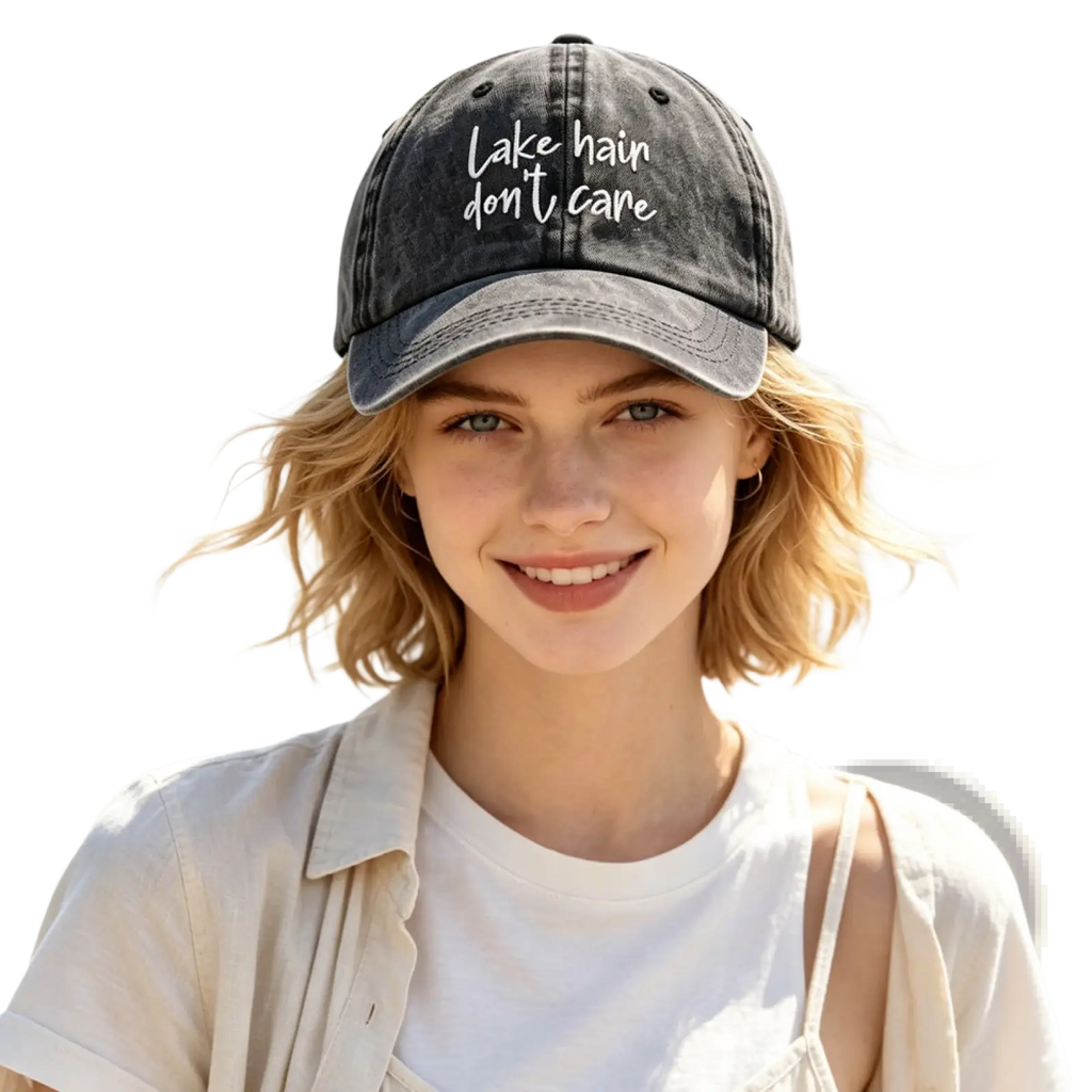 Dark gray distressed denim baseball cap with white embroidered lake hain dont care text from lake hair cap set