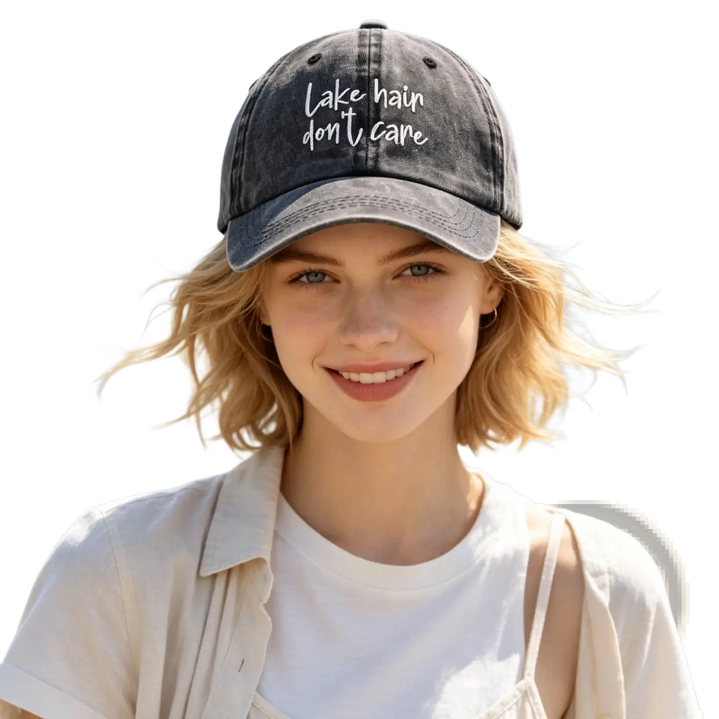 A faded black distressed baseball cap with white embroidered text lake hair don’t care for casual wear