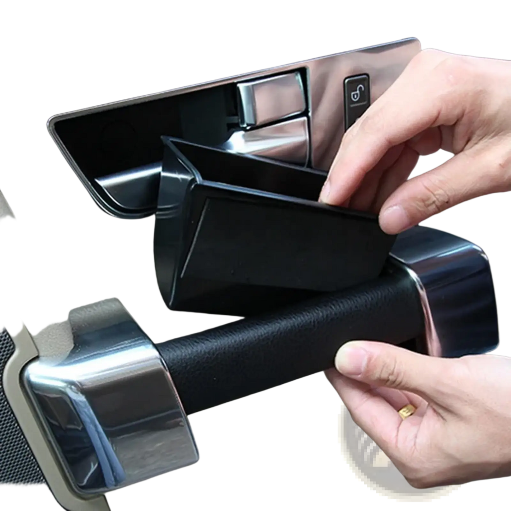 Black plastic Land Rover Discovery 4 car door handle storage box tray with sleek rectangular design and smooth edges
