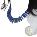 A bold deep blue lapis lazuli choker necklace composed of rectangular gemstone beads for statement jewelry