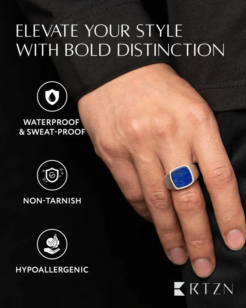 A sleek oxidized stainless steel lapis lazuli cushion signet ring with a vibrant blue square bezel stone