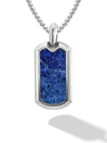 A sleek silver dog tag necklace with a vibrant blue lapis lazuli stone inset on a matching box chain