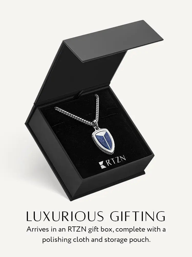 Silver chain necklace with lapis lazuli shield pendant in 316l stainless steel displayed in black rtzn gift box