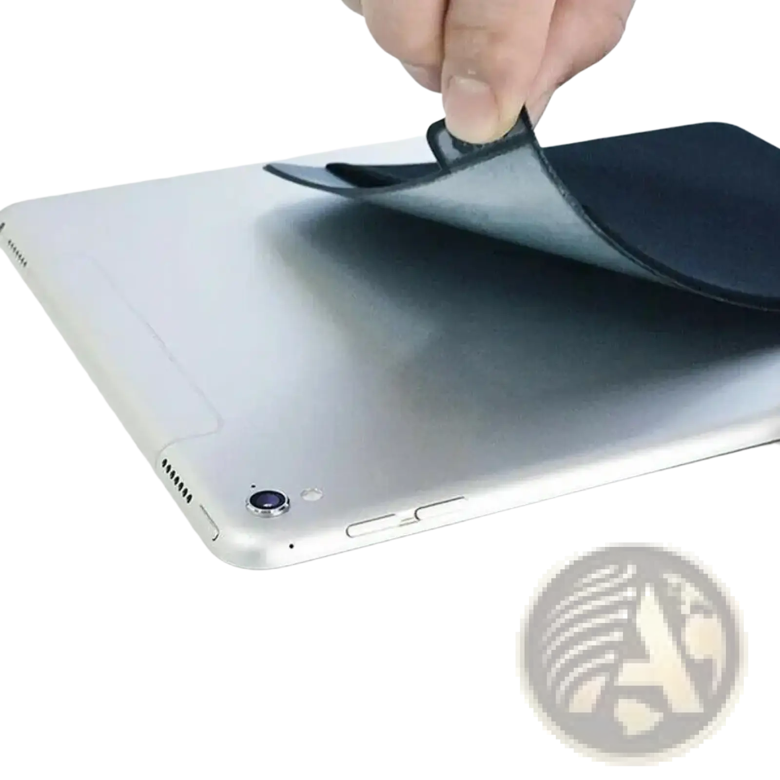 Black flat back sticker on the back side of a silver laptop for a laptop back storage pouch for mouse and accessories