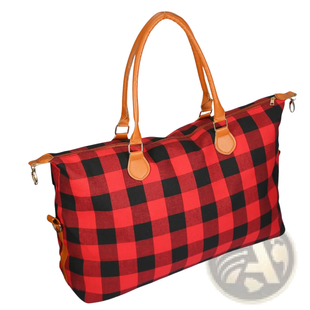Large canvas duffle bag plaid travel tote with red and black design and tan leather handles for overnight use