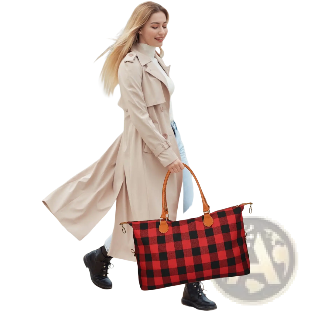 Large canvas duffle bag plaid travel tote in red and black with tan leather handles for overnight use