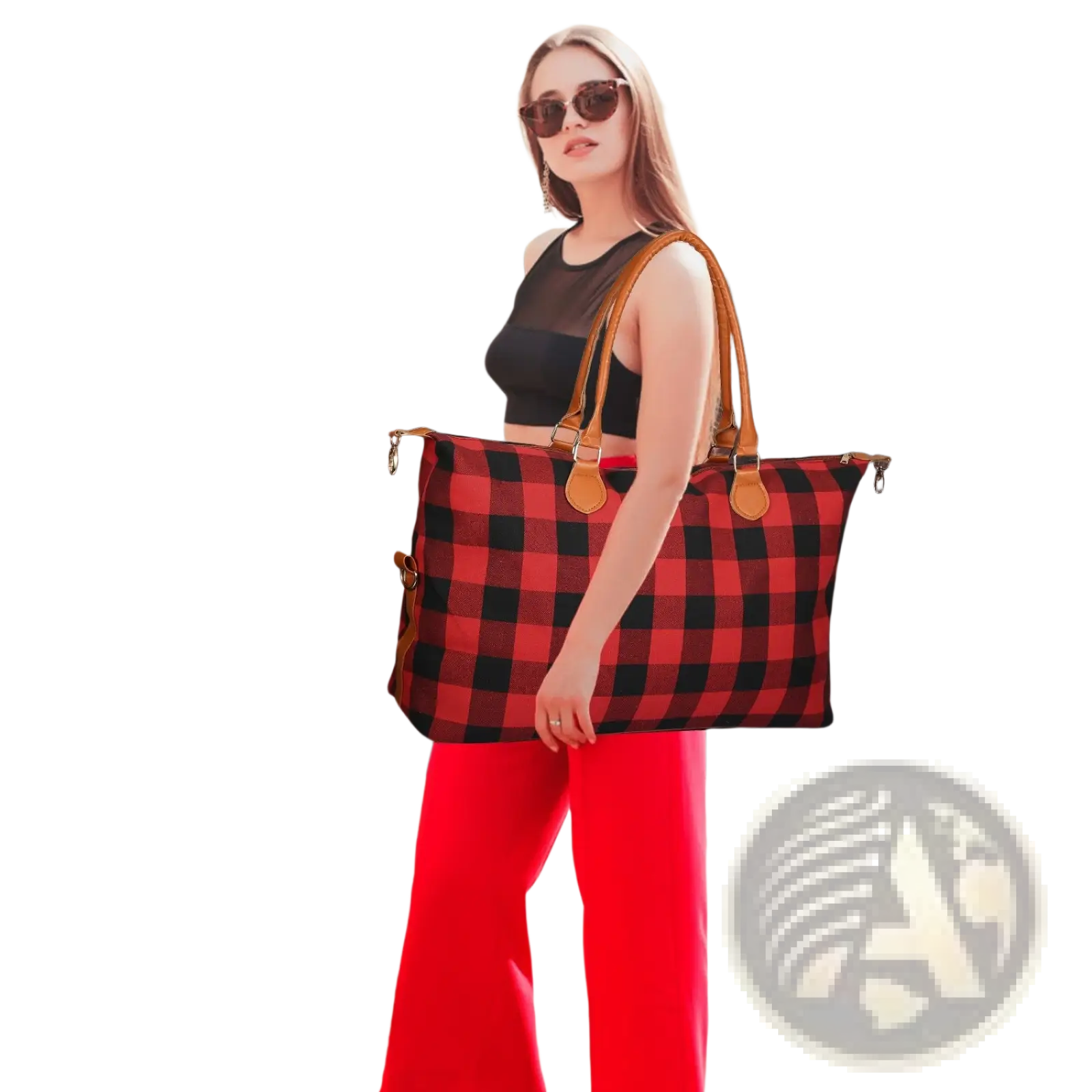 Large canvas duffle bag with red and black plaid design and tan leather handles for travel and overnight use