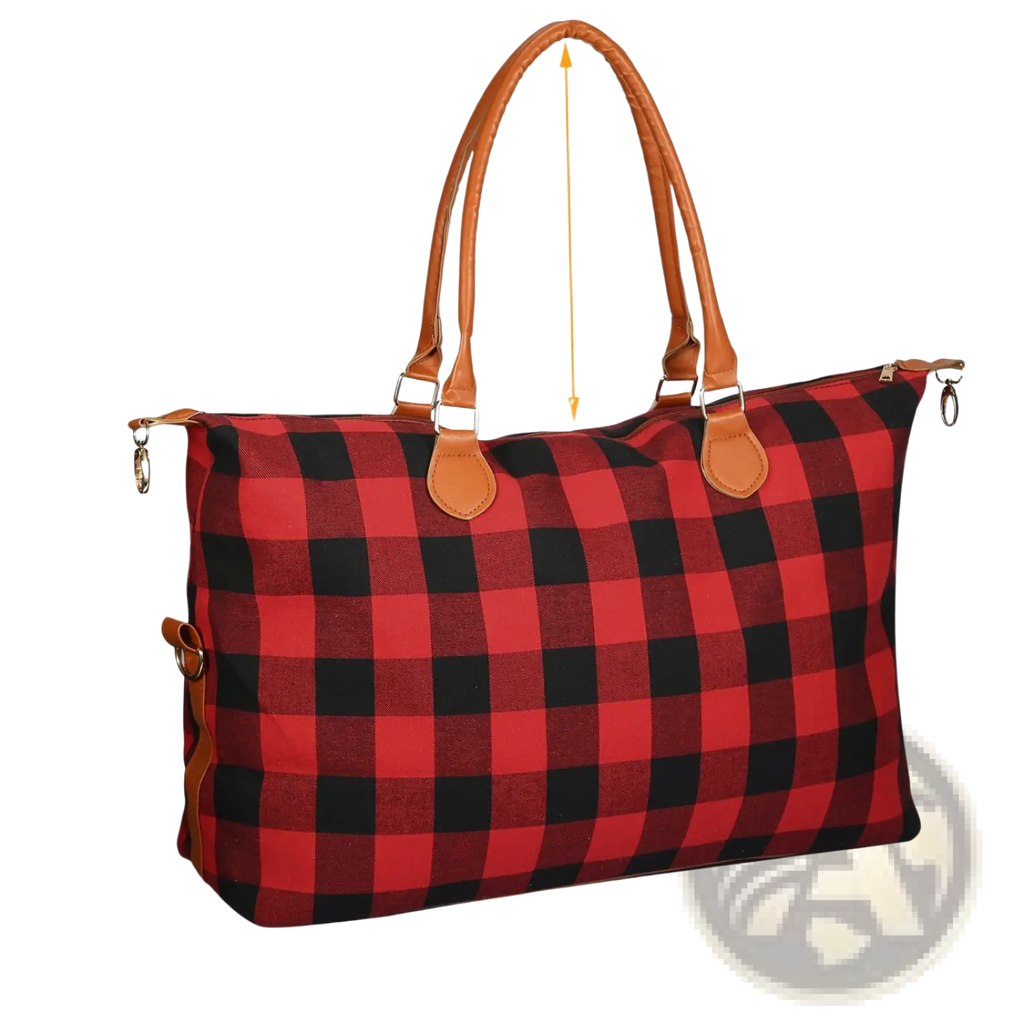 Large canvas duffle bag with red and black plaid design and tan leather handles for travel and overnight use