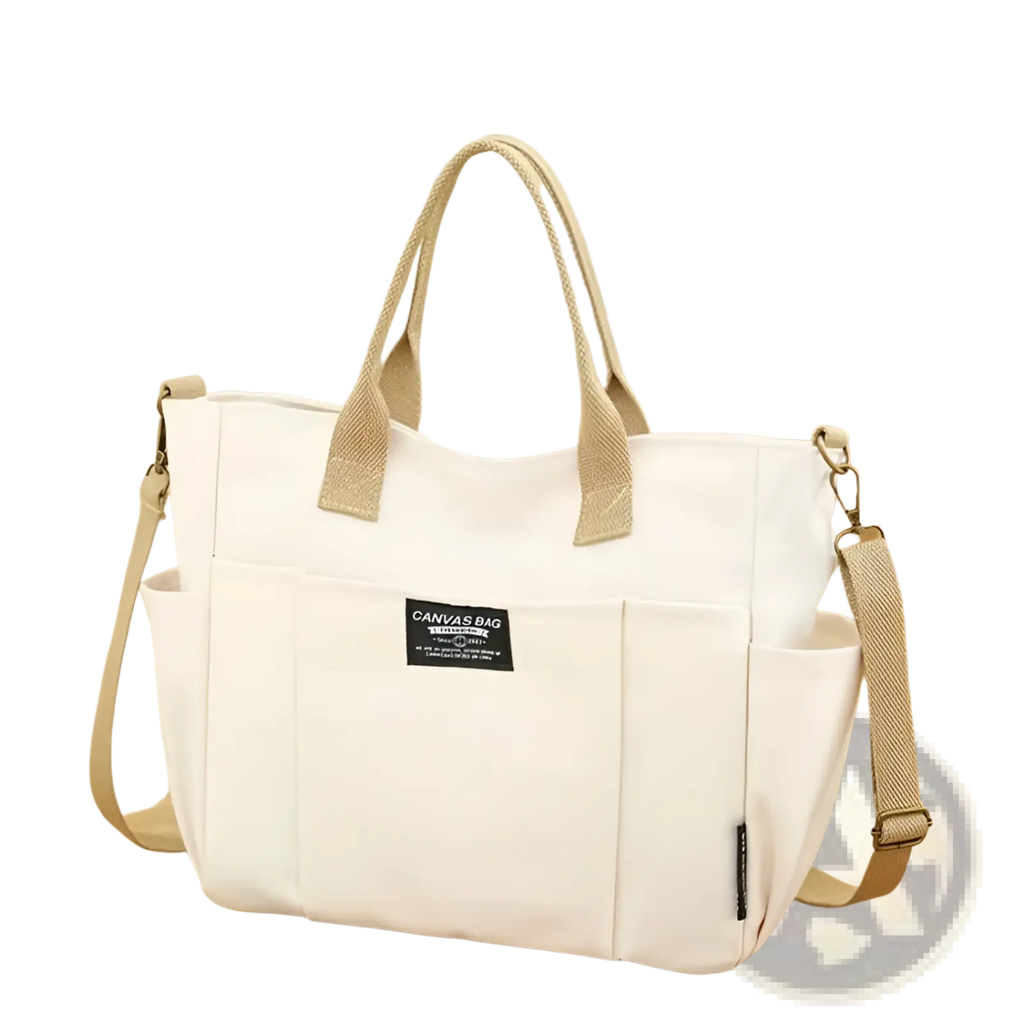 Cream-colored large capacity canvas commuter tote with beige woven leather straps and black canvas bag label on front
