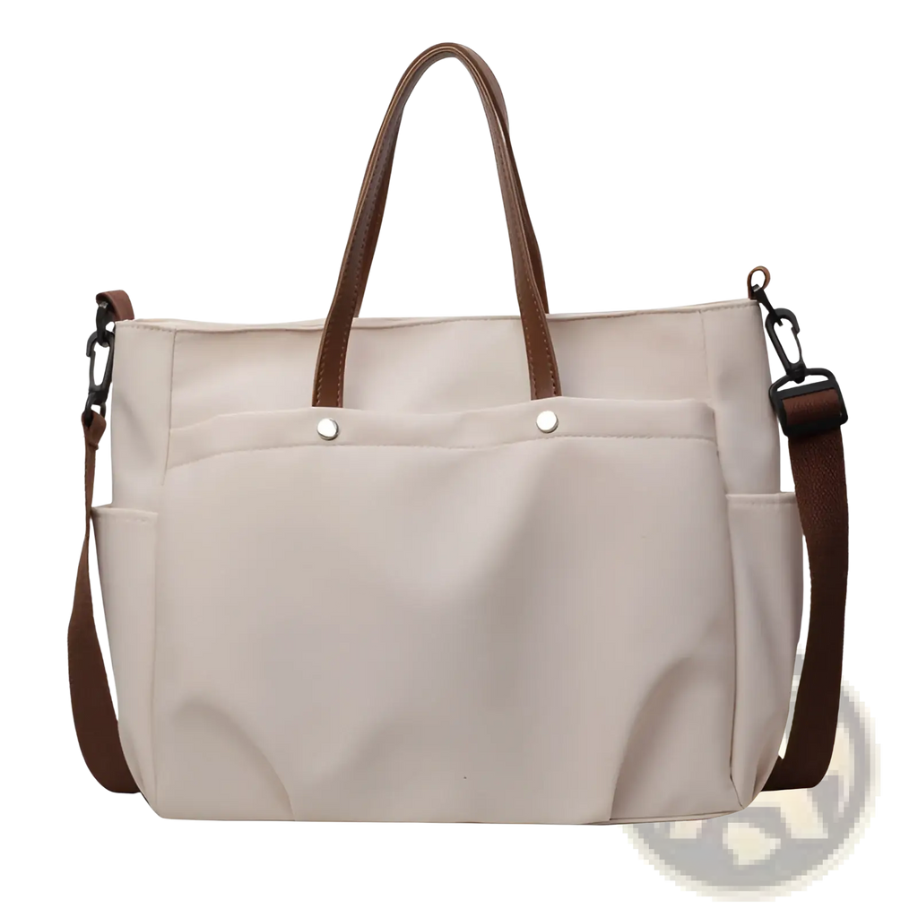Beige canvas tote bag with large capacity leather handles and shoulder strap for versatile carrying options
