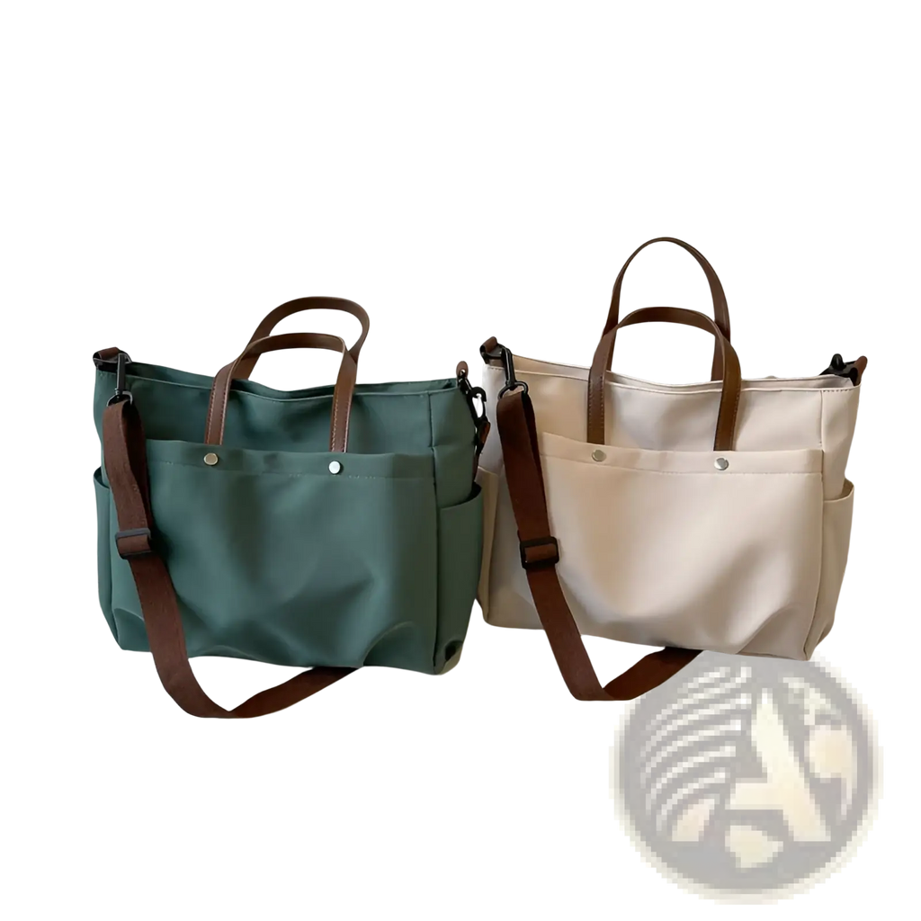 Two large capacity canvas tote bags in muted green and off-white with brown leather handles and silver hardware