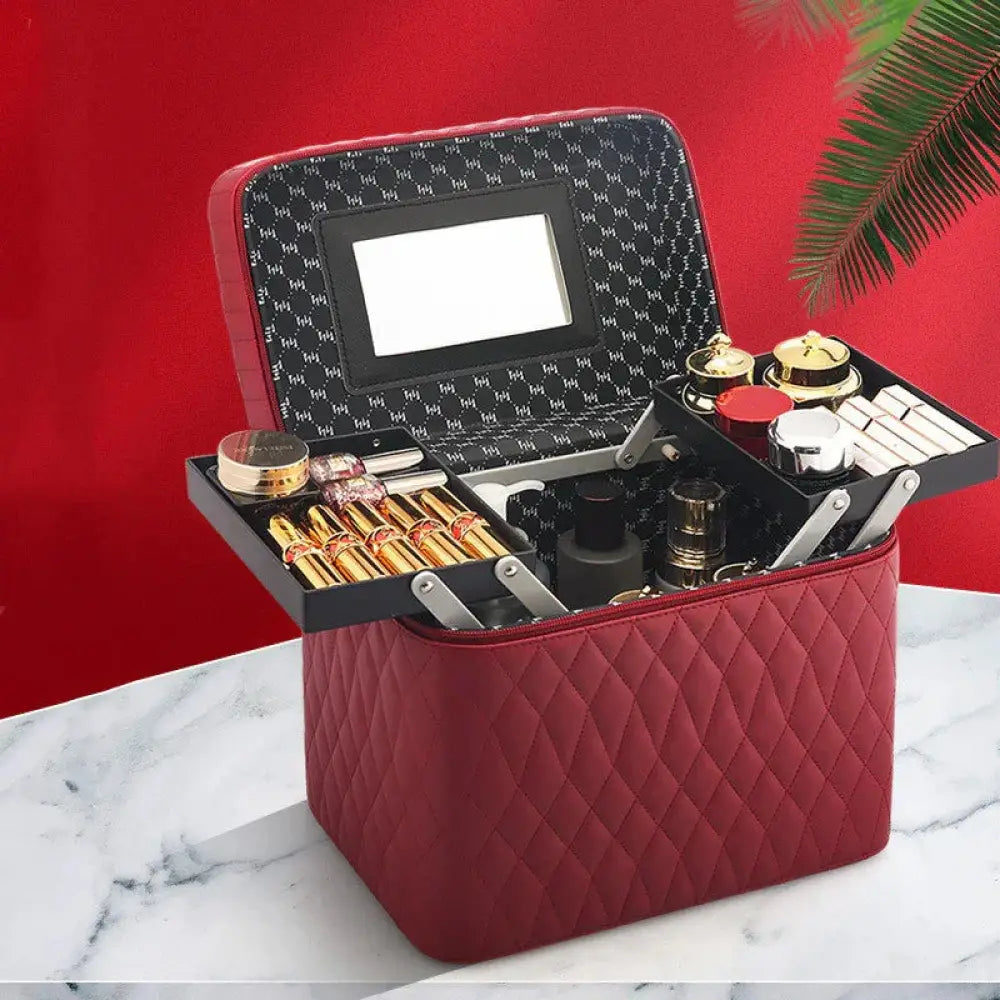 Red quilted leather makeup organizer with built-in mirror and multiple compartments for travel cosmetics