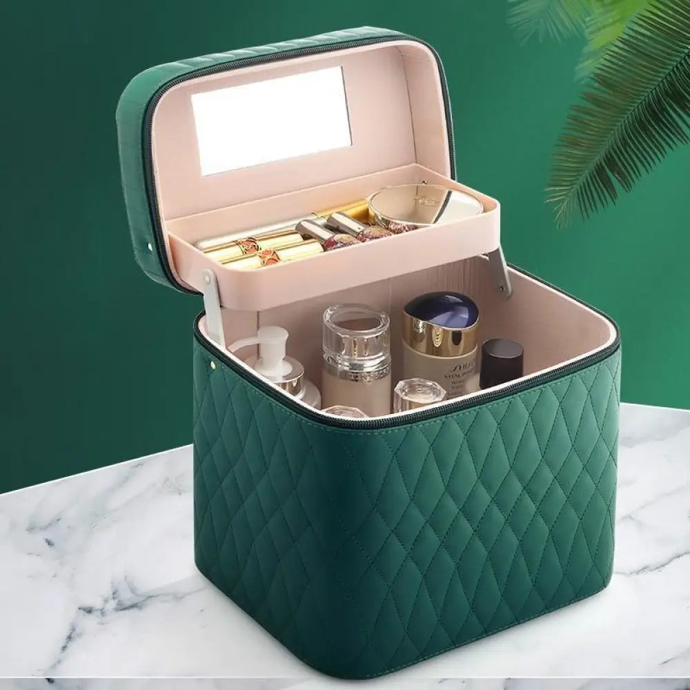 Emerald green quilted Korean travel cosmetic case with built-in mirror and pink interior for makeup organization