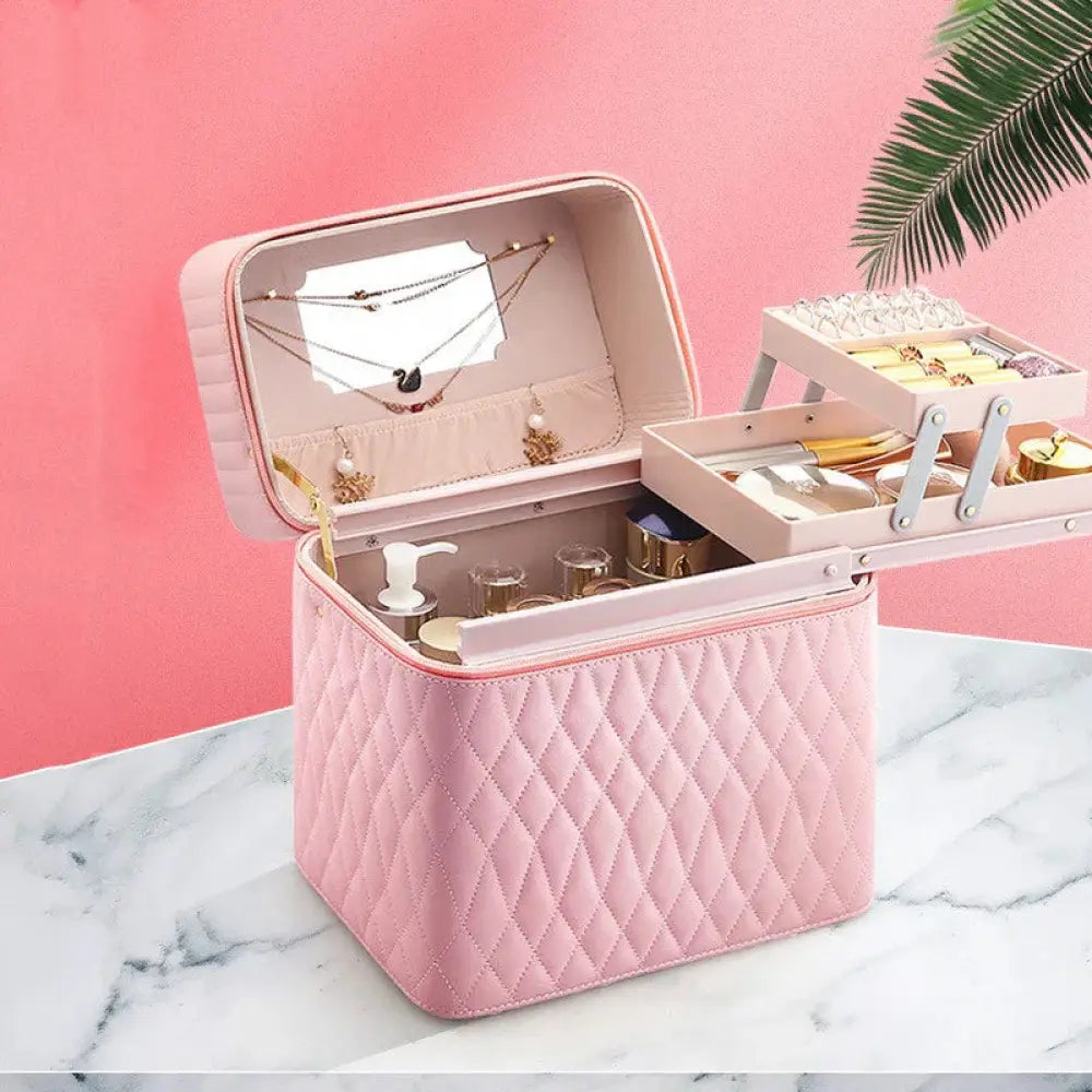 Pink quilted korean travel cosmetic case with mirrored lid and tiered compartments for jewelry and makeup organization