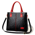 Black leather large capacity shoulder bag with red handles and embossed lettering design on the front