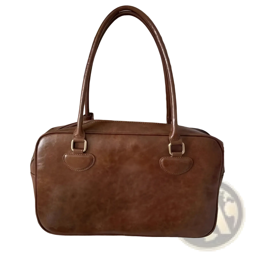 Large capacity brown leather shoulder bag with rounded top handles metallic hardware and bear charm accessory