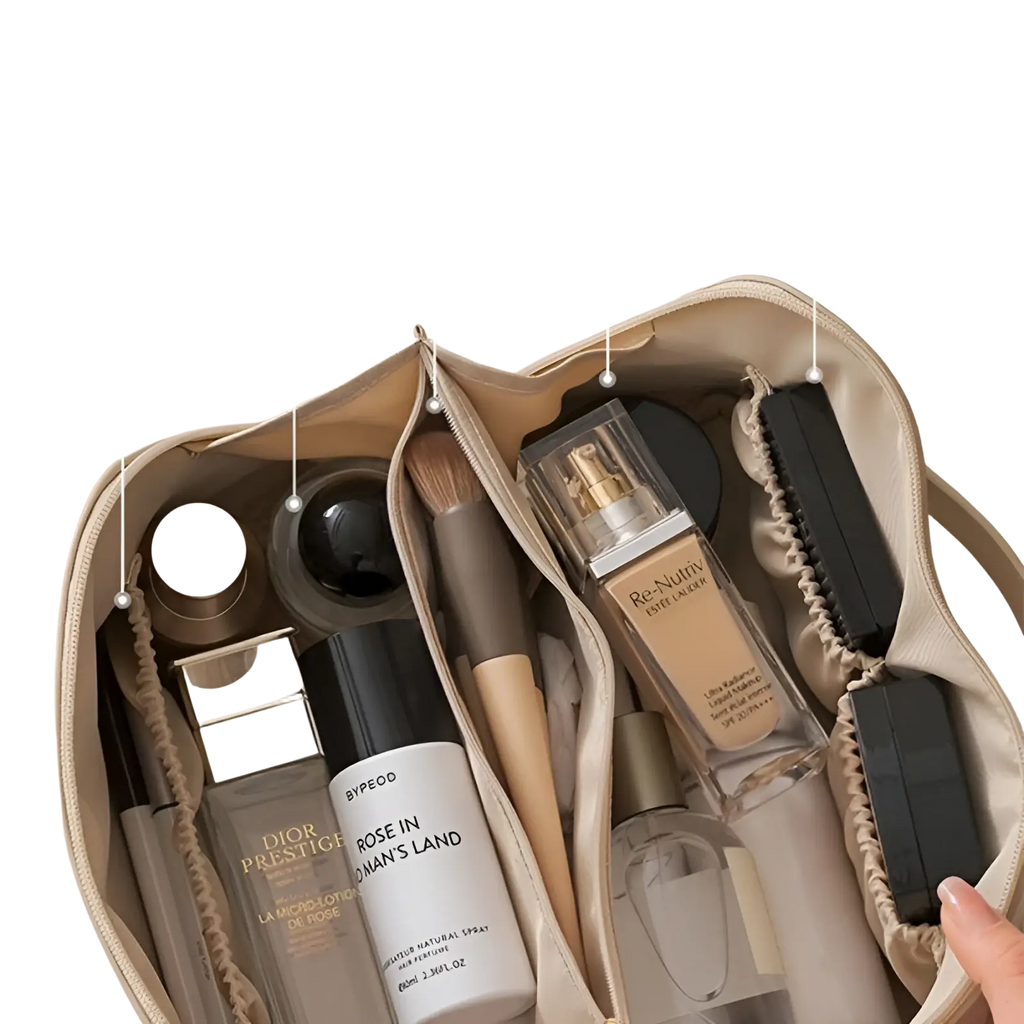 Beige leather travel makeup bag organizer with large capacity and multiple compartments holding cosmetics and brushes