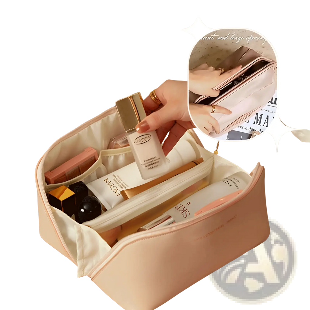 A soft blush pink leather travel makeup bag organizer with cream interior and multiple compartments for cosmetics