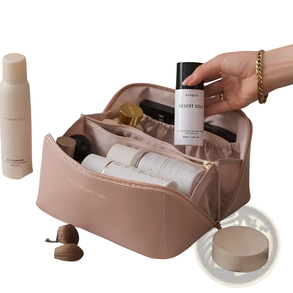 A blush pink large capacity pu leather travel makeup bag with a gold-tone zipper and subtle embossed text