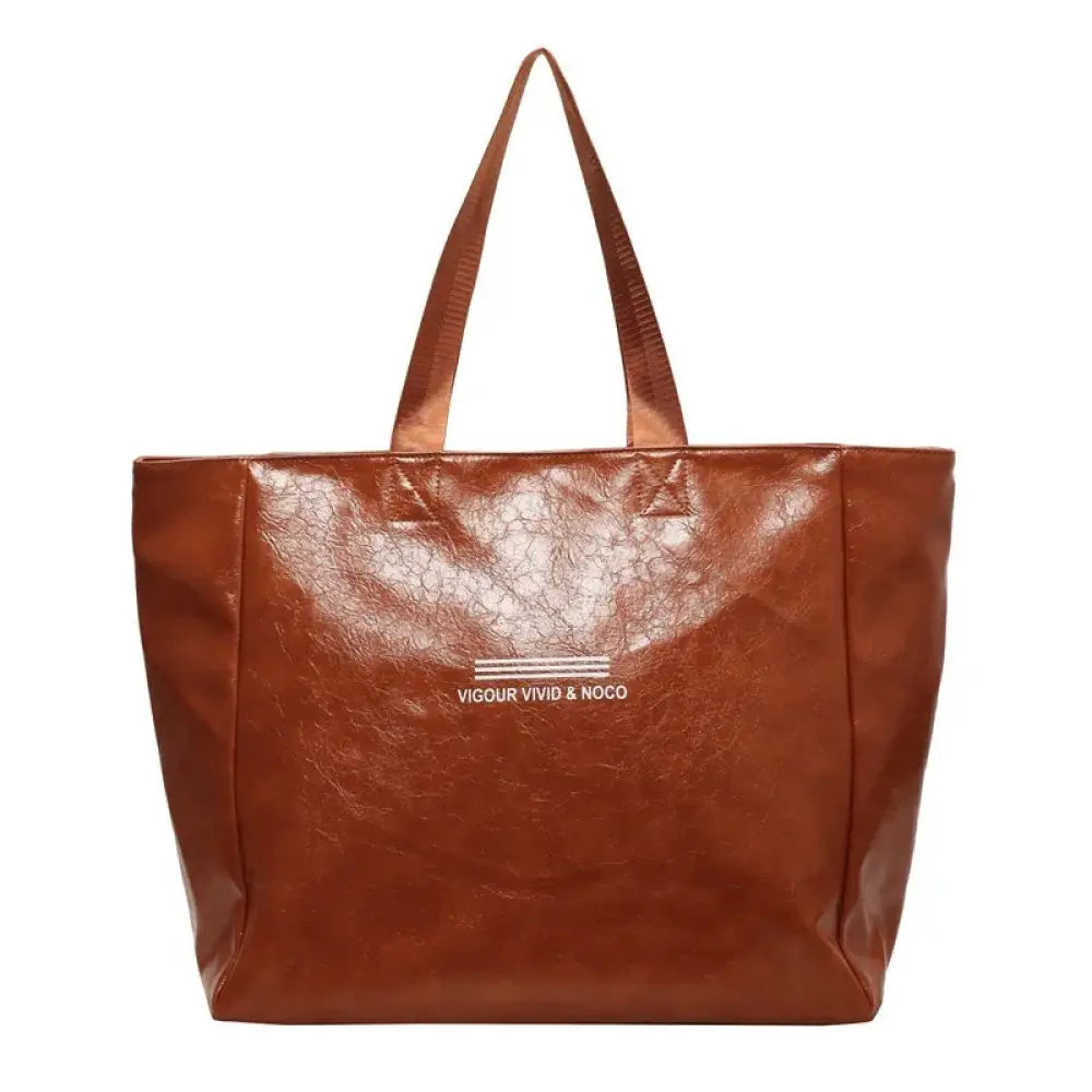 Large waterproof glossy brown faux leather shoulder tote bag with white vigour vivid and noco text on the front
