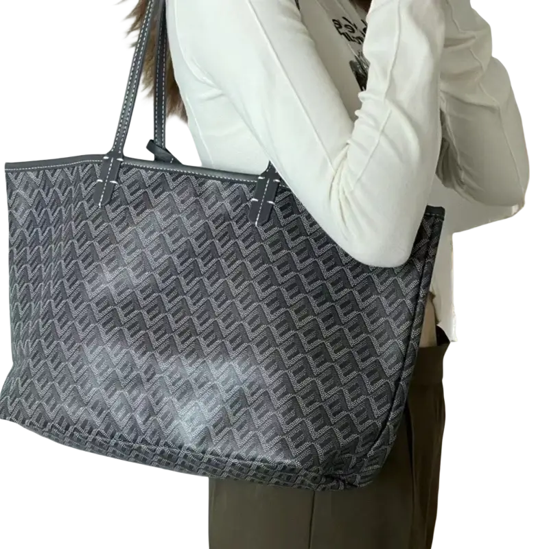 Large leather tote bag with matching clutch in gray and black patterned leather features sturdy handles and modern silhouette 1-2cm shorter