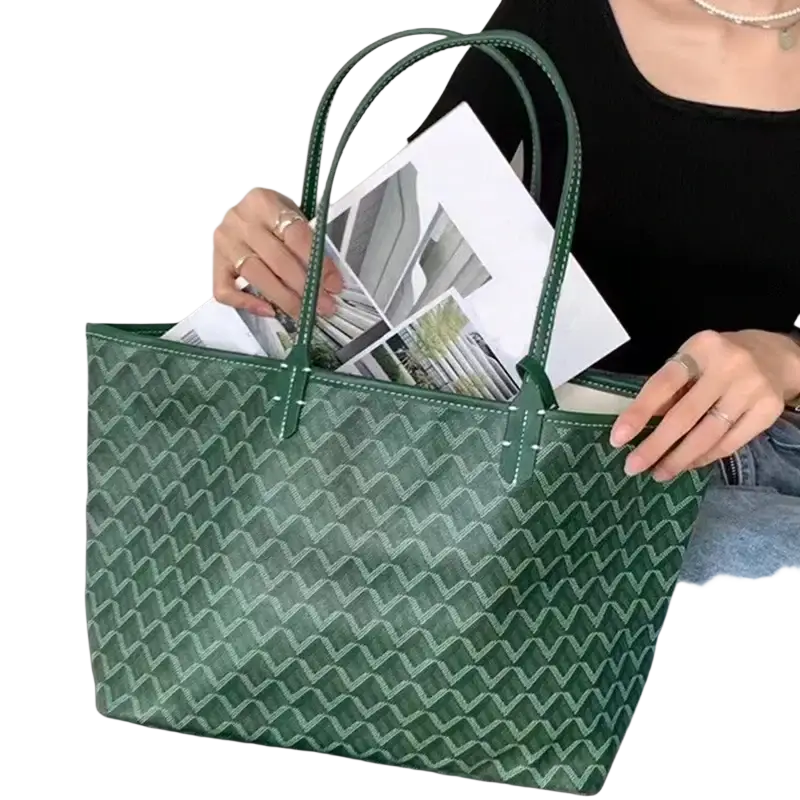 Large green leather tote bag with repeating zigzag pattern and matching handles 1-2cm shorter clutch included