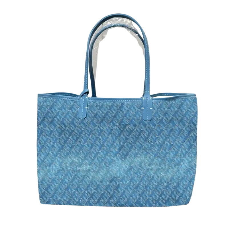 A light blue large leather tote bag with a repeating geometric pattern and matching handles 1-2cm shorter
