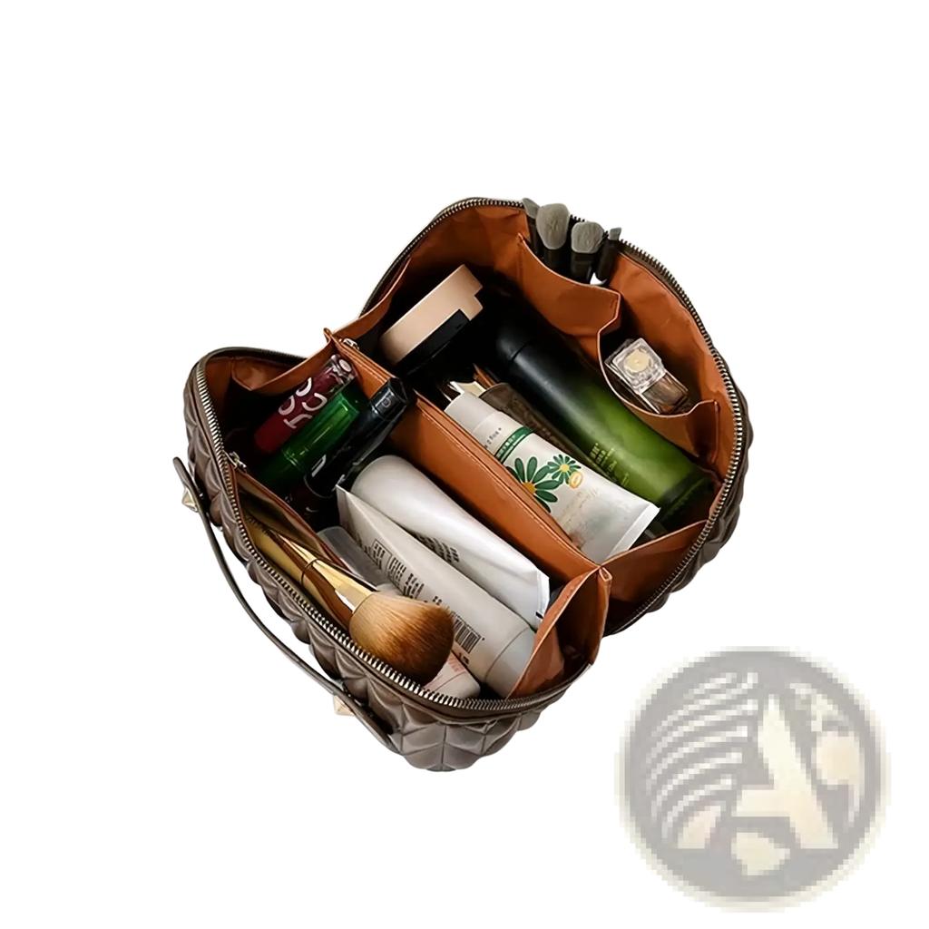 Large leather travel makeup bag in brown quilted leather with orange interior lining and multiple compartments