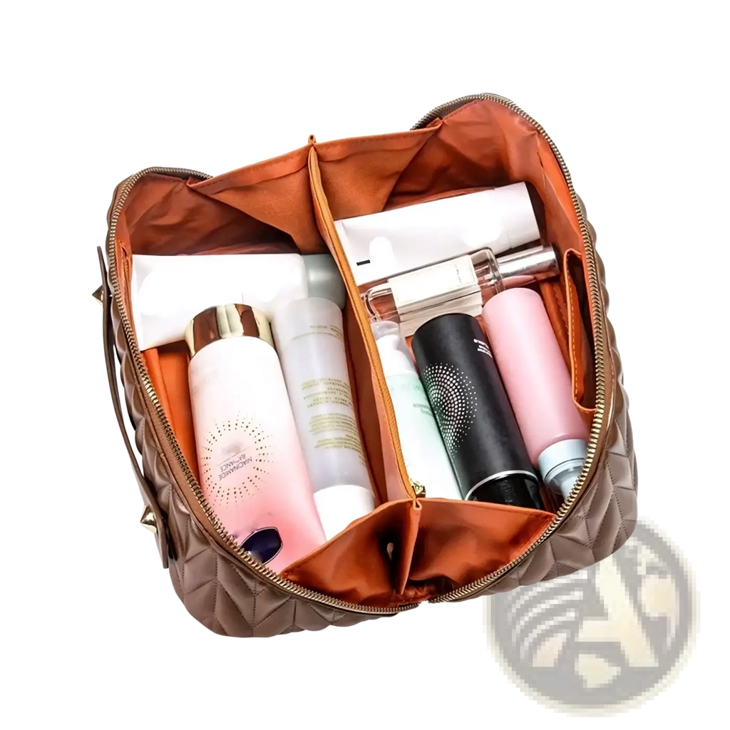 Large leather travel makeup bag with brown quilted exterior and orange interior lining for toiletry organization