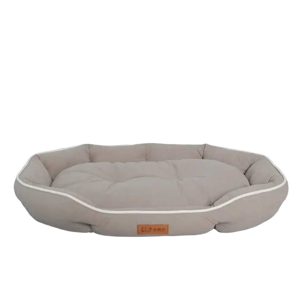 Large pink plush sofa sleeping bed for dogs with beige plush exterior, cream piping, and soft cushioned interior