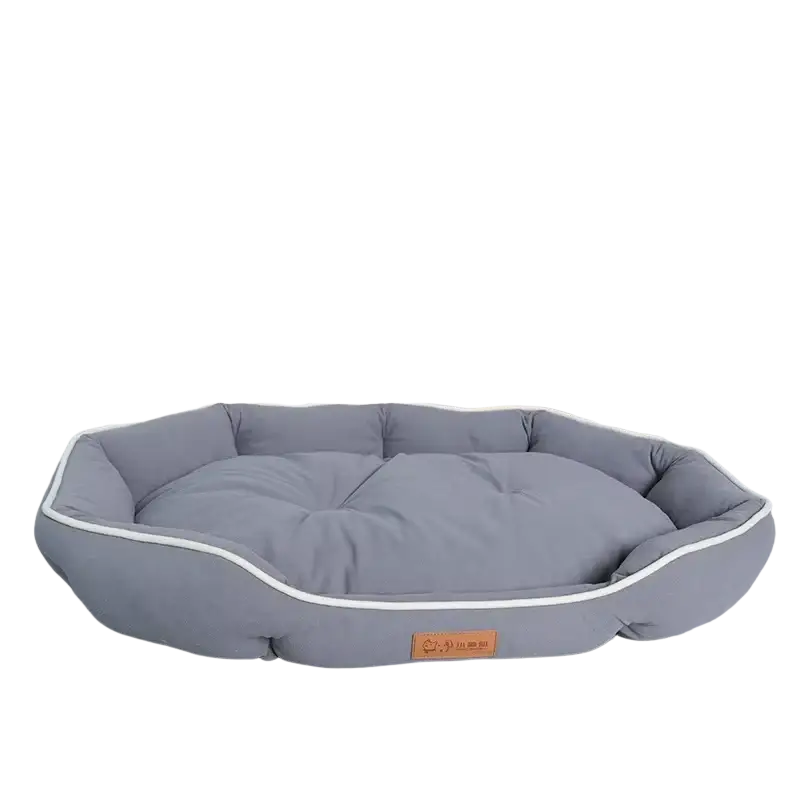Gray plush sofa sleeping bed with white piping and orange brand tag designed for large dogs comfort