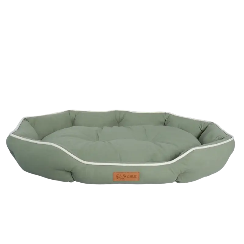 Olive green plush sofa sleeping pet bed with cream piping and a soft cushioned interior for dogs