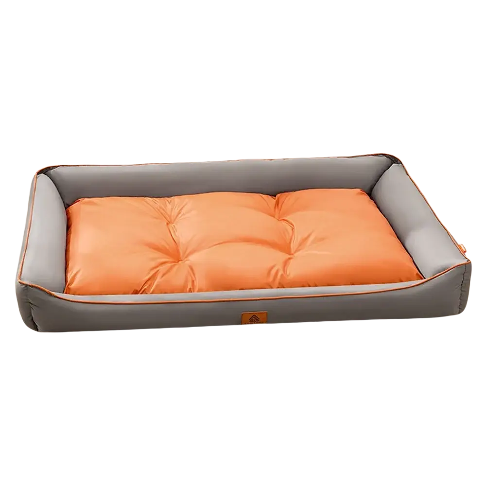 Large pink plush sofa sleeping bed for dogs with an orange tufted cushion inside a gray pet bed with orange piping