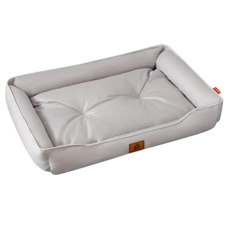 Large pink plush sofa sleeping bed for dogs with white tufted cushioning and padded faux leather exterior