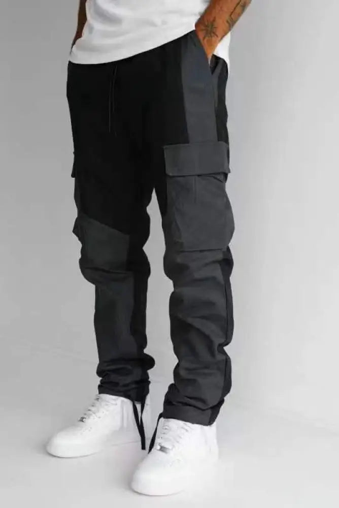Men’s multi pocket urban techwear tactical joggers in black and dark gray with a modern two tone cargo design