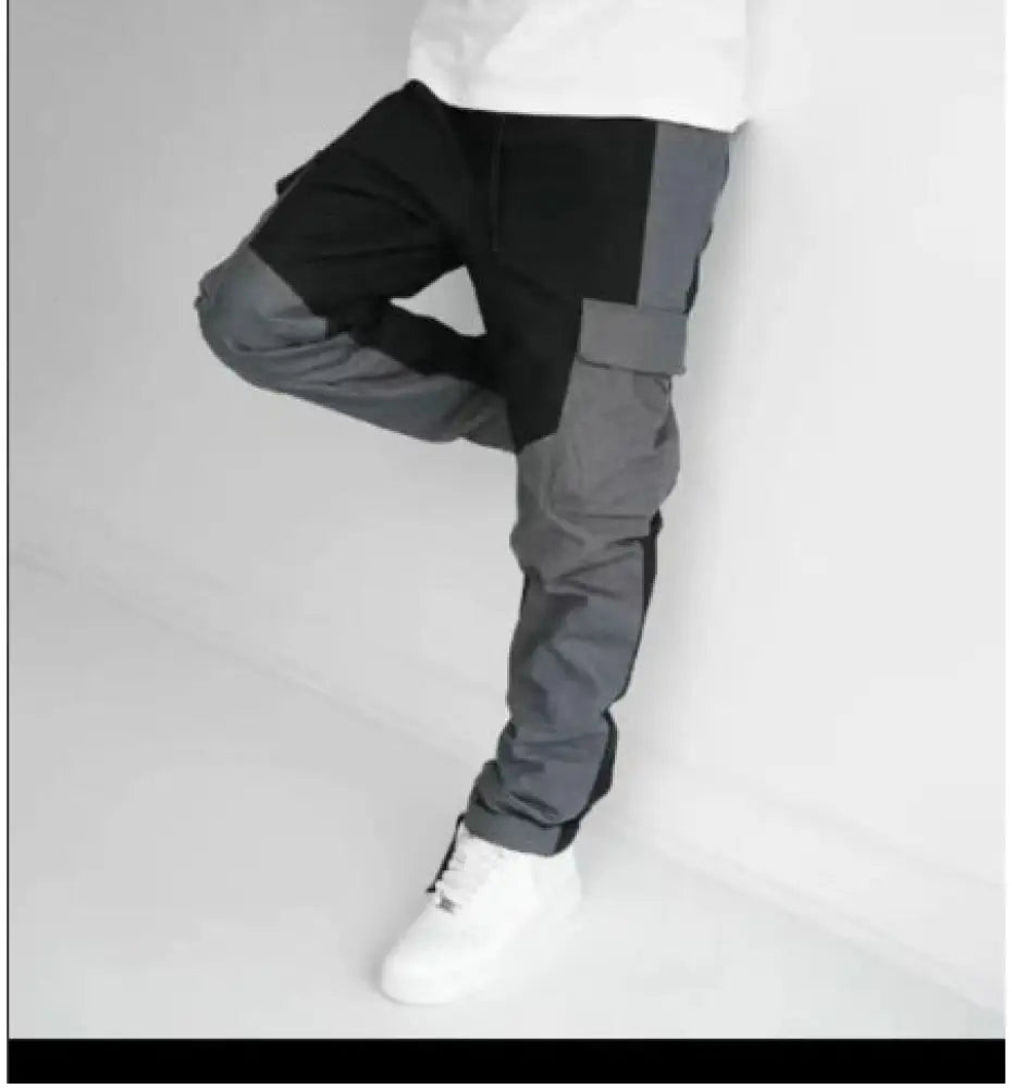 Men’s multi pocket urban techwear tactical joggers in black and gray with a modern two tone design